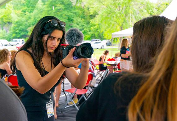 Image of Marist student taking a photo with professional camera